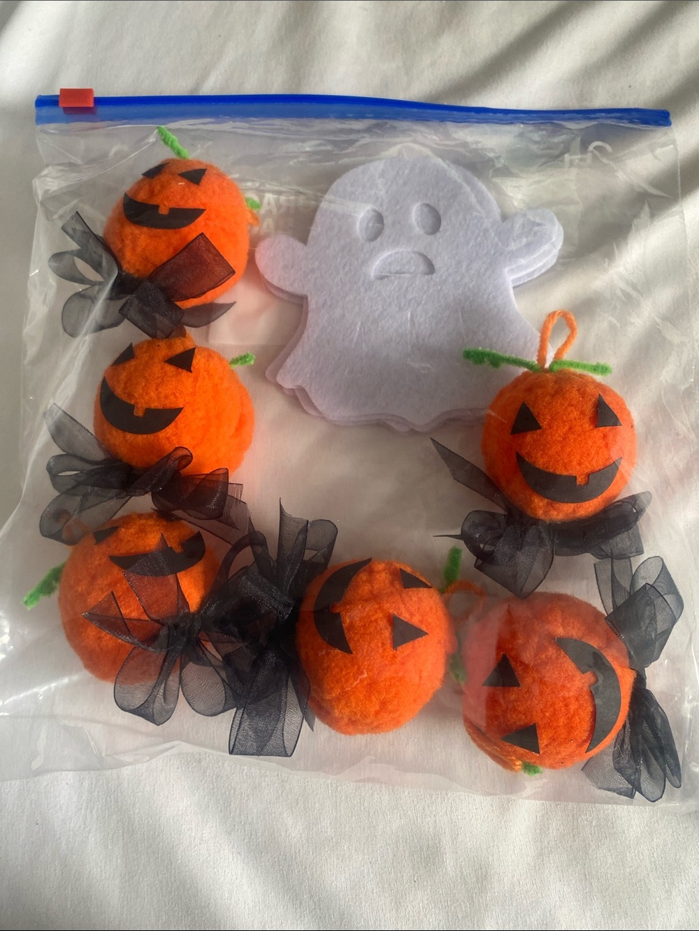 Source Unknown Orange Pumpkin Ball with White felt Ghost.